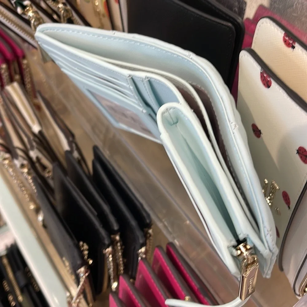 Kate Spade Carey Medium Compartment Bifold Wallet 
COLOR: Turquoise - Picture 6 of 16